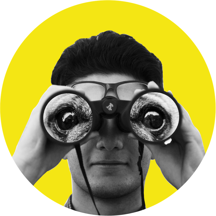 Image of a man looking through binoculars.